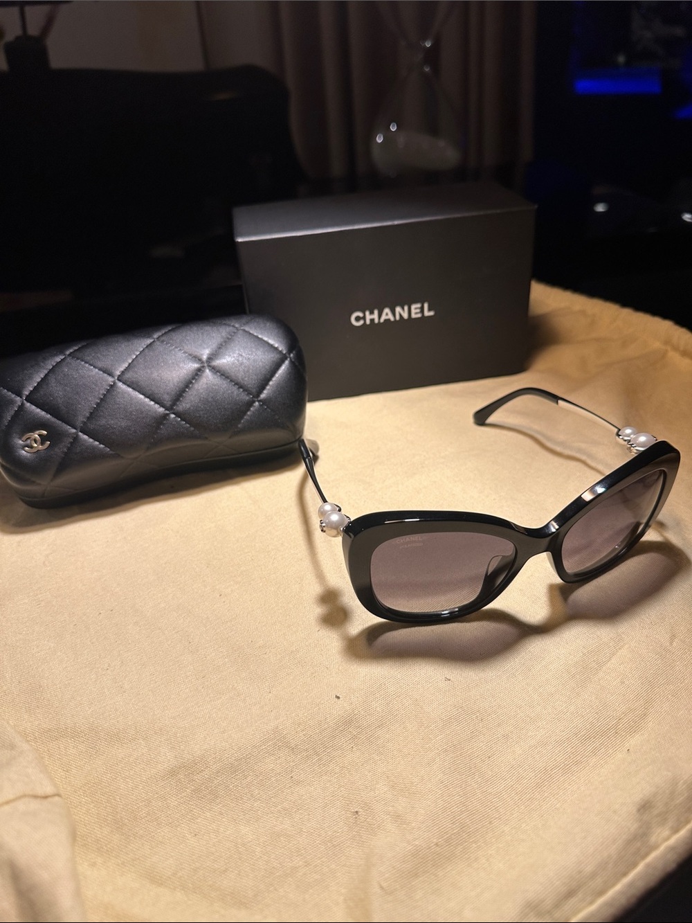 CHANEL Black Cat-Eye Sunglasses with Pearl Temple Detail